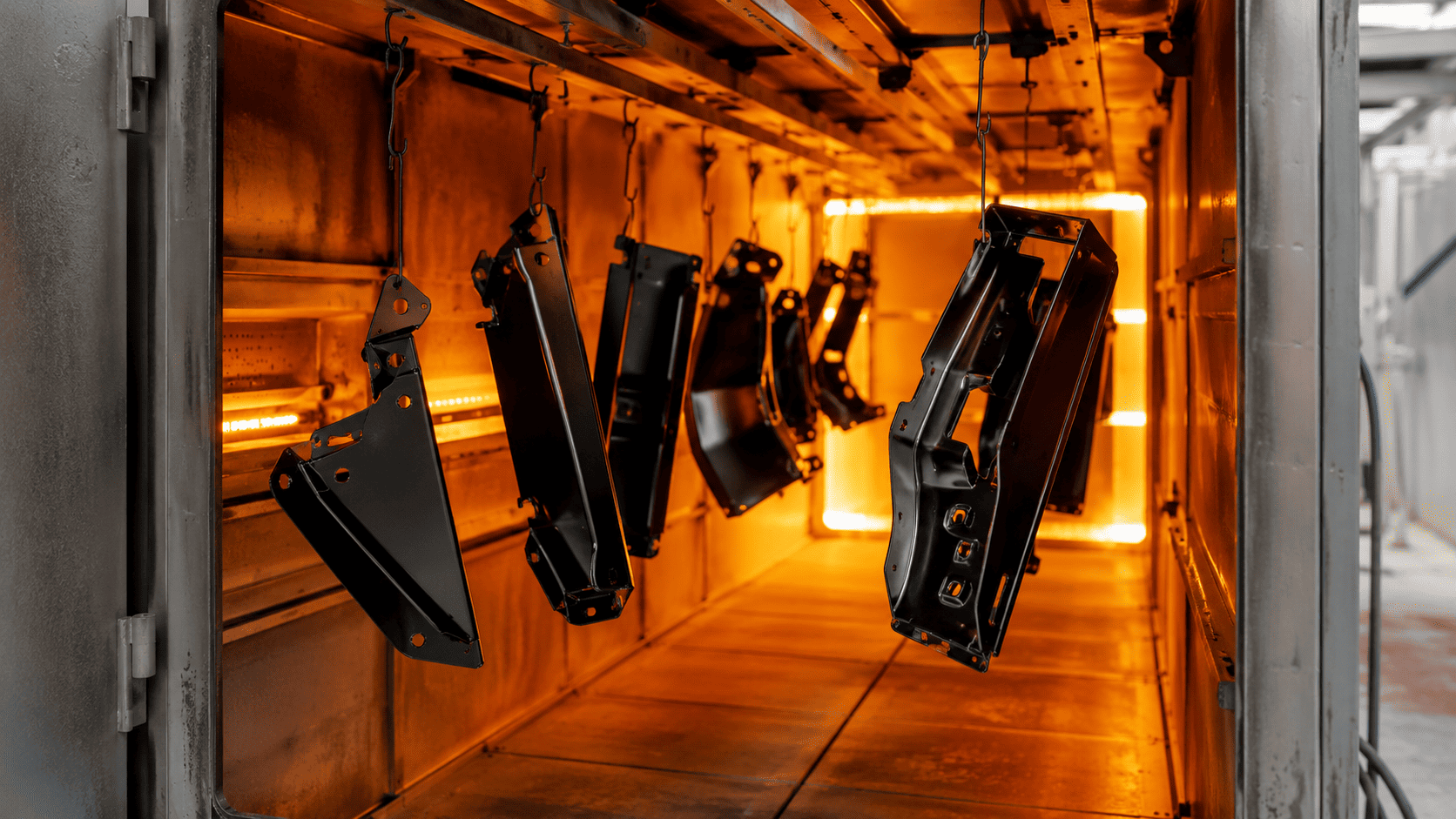 Sandblasting removes rust and old coating from a metal part before powder coating.